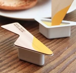 Butter packaging with a built-in butter knife